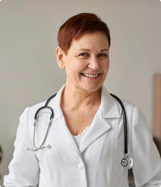 smiling doctor with a stethoscope around her neck